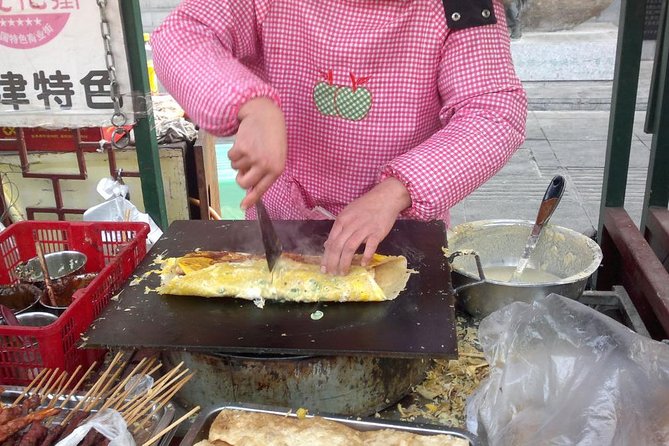 3-Hour Private Night Tour: Beijing Foodie Experience - First stop: Xinjiang lamb kabobs and strong white liquor