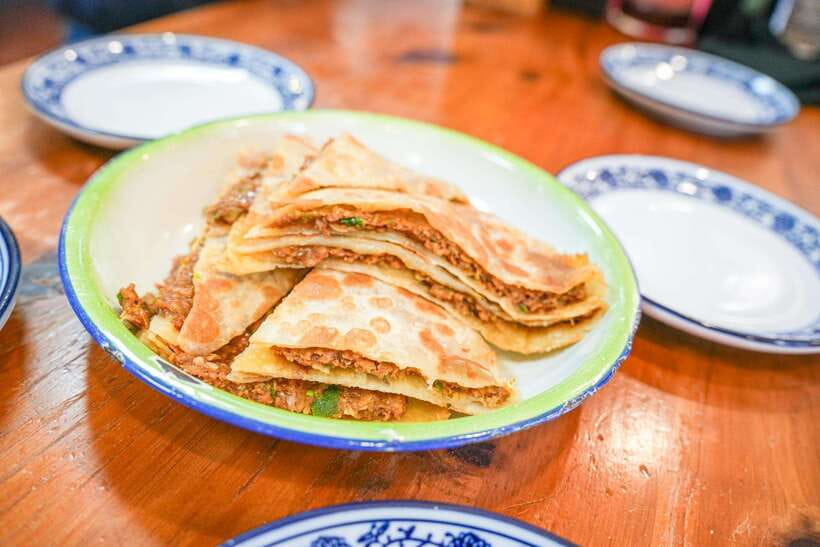Beijing: Hutong Breakfast Food Tour - Mr. Yu’s beef flatbread and tofu pudding