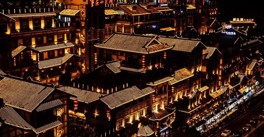 Chongqing: Illuminated Night Tour with Cruise or Hot Pot - Hongya Cave glows above the Jialing River