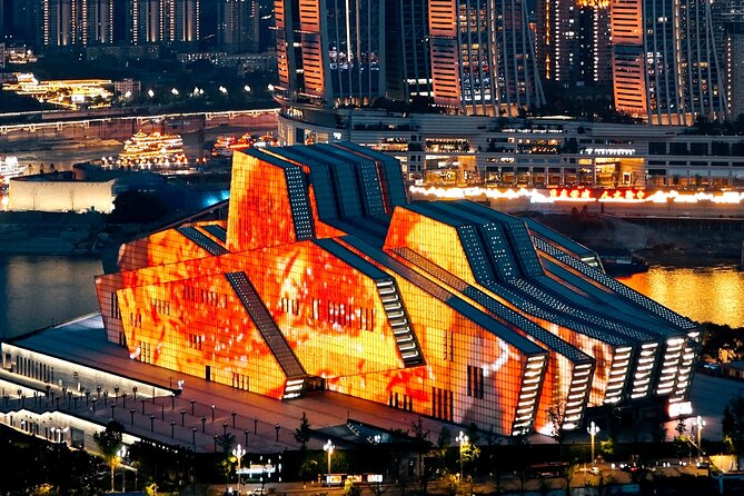 Chongqing private luxury city tour: Must-sees All in One - The Grand Theatre frames Hongyadong after dark