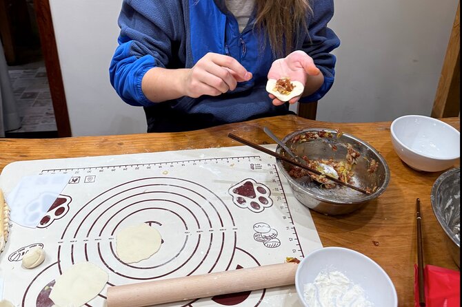 Dumpling Cooking Class and Local Market Tour - What the courtyard setting adds