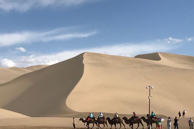 Dunhuang Private Day Tour Mogao Grottoes, Singing Dunes and Crescent Moon Spring - What the 8-cave option means for your day