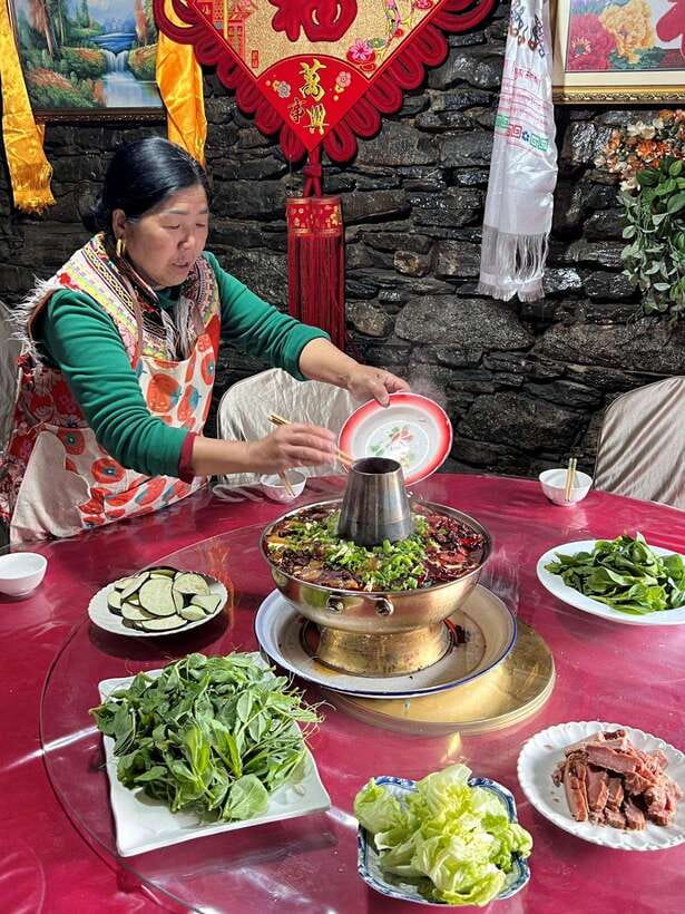 From Chengdu: Tibetan Village Live as a Tibetan Day Tour - The hill, prayer flags, and Lungta blessing