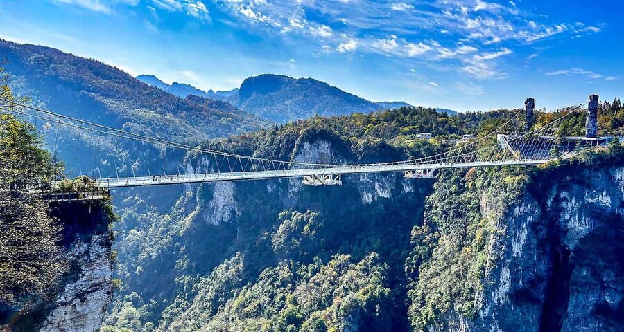 One Day Mini Group Tour to Glass Bridge and Tianmen Mountain - The 99 bends and 12-level escalator