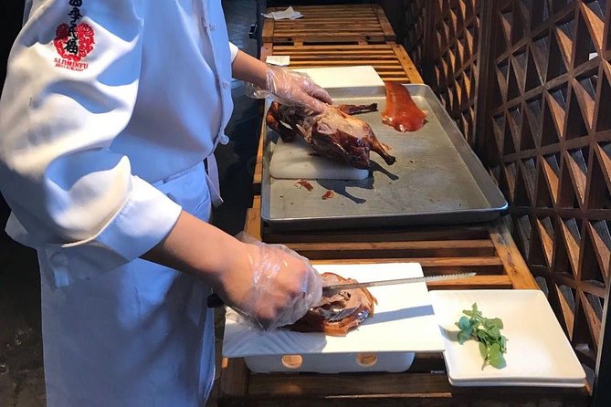 Private Tour to Pearl Market Acrobatic Show & Peking Duck Dinner - Who will enjoy this evening most
