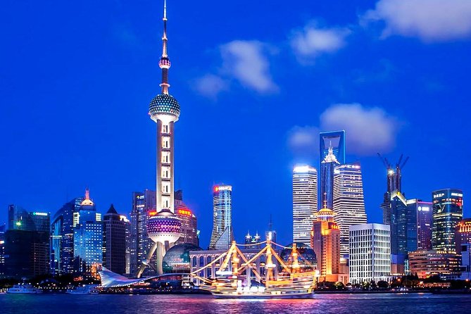 Shanghai Night River Cruise Tour with Xinjiang Style Dining Experience - The Huangpu River cruise: old Shanghai on one bank, new Shanghai on the other