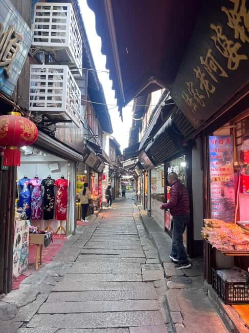 Shanghai: Zhujiajiao Water Town with Calligraphy Experience - A boat ride through the old waterways