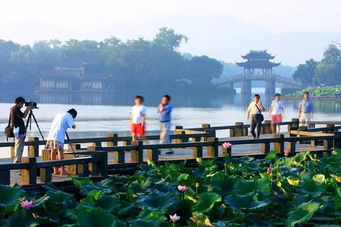 Wuzhen Water Town Self-Guided Tour with Private Transfer from Hangzhou - Xizha: ferries, bridges, and longer walking time